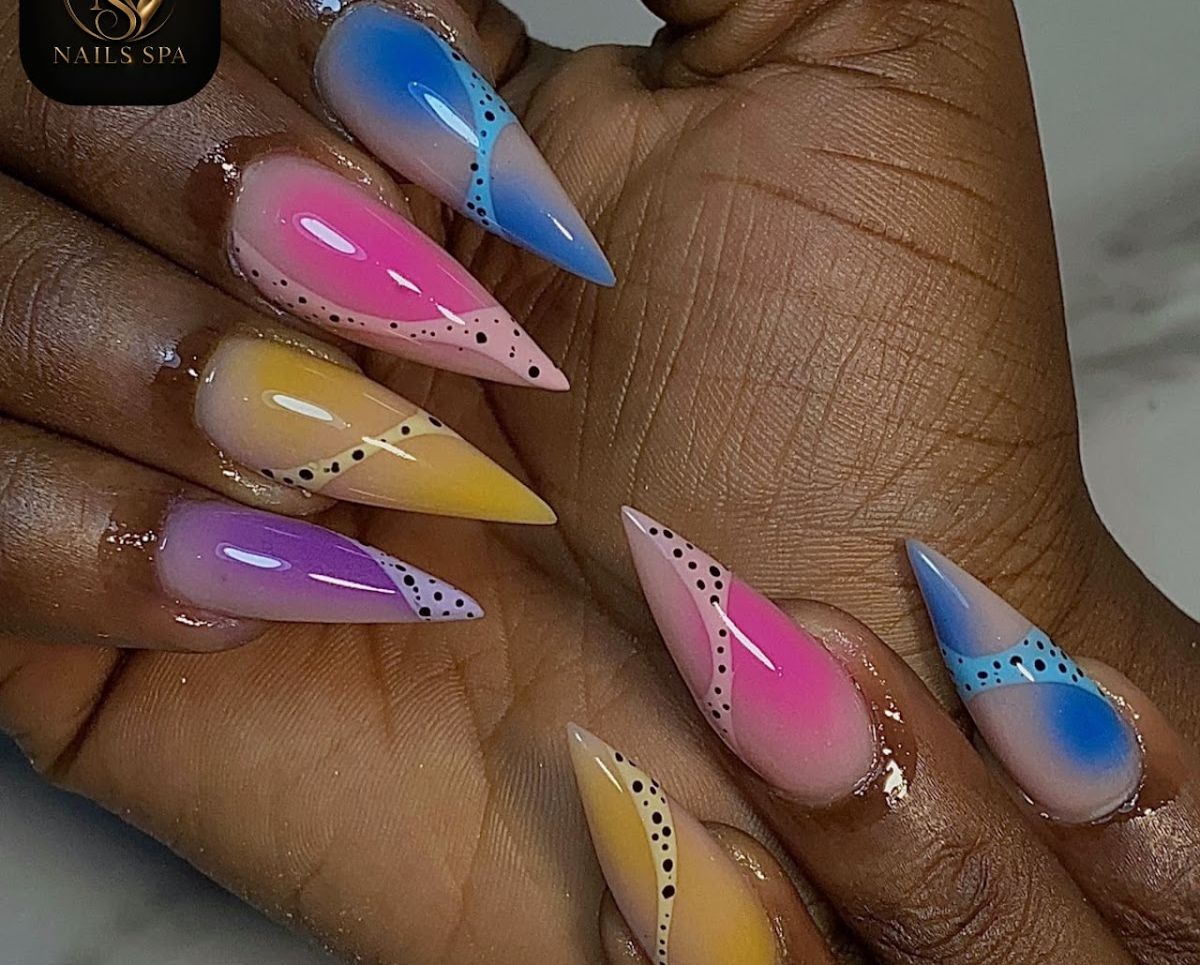 Colorful ombré stiletto nail art with hand-painted detail at Nails Spa in Decatur, GA
